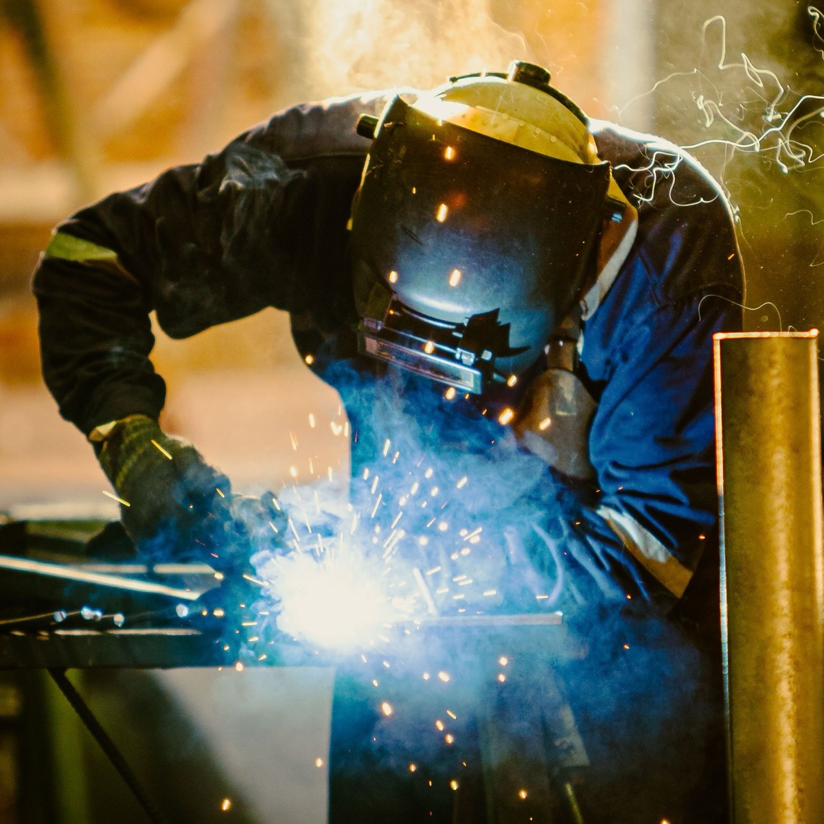 A Regal Staffing welder at work, sparks flying